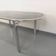 Vintage oval dining table in smoked glass and chrome metal, Space Age style.
