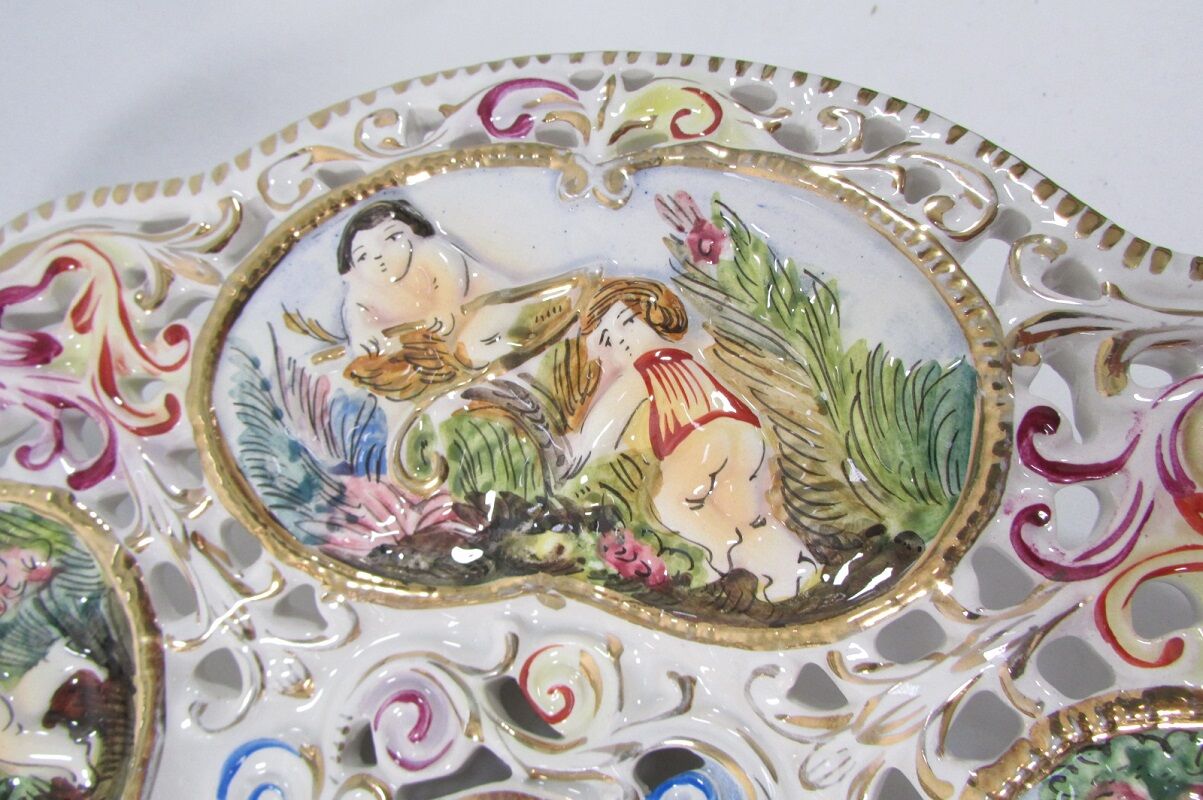 Capedimonté openwork plate, 4 seasons putto