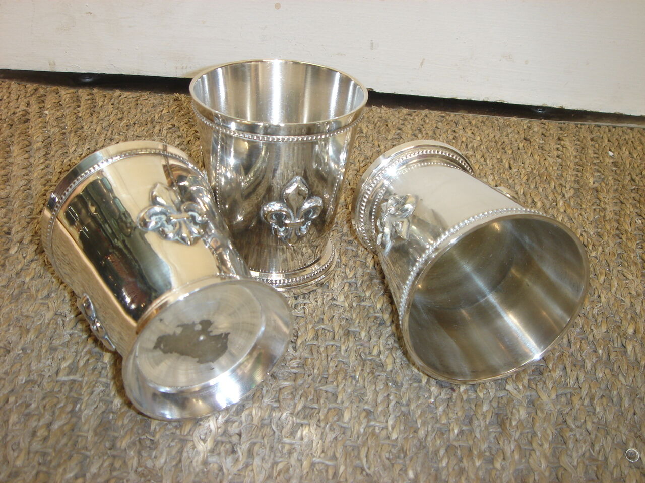 3 silver cups, lily flower