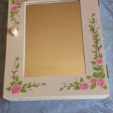 White mirrored toilet cabinet with floral pattern