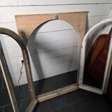Old arched window made of fir wood
