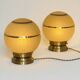 Pair of large art deco globe table lamps with brass legs