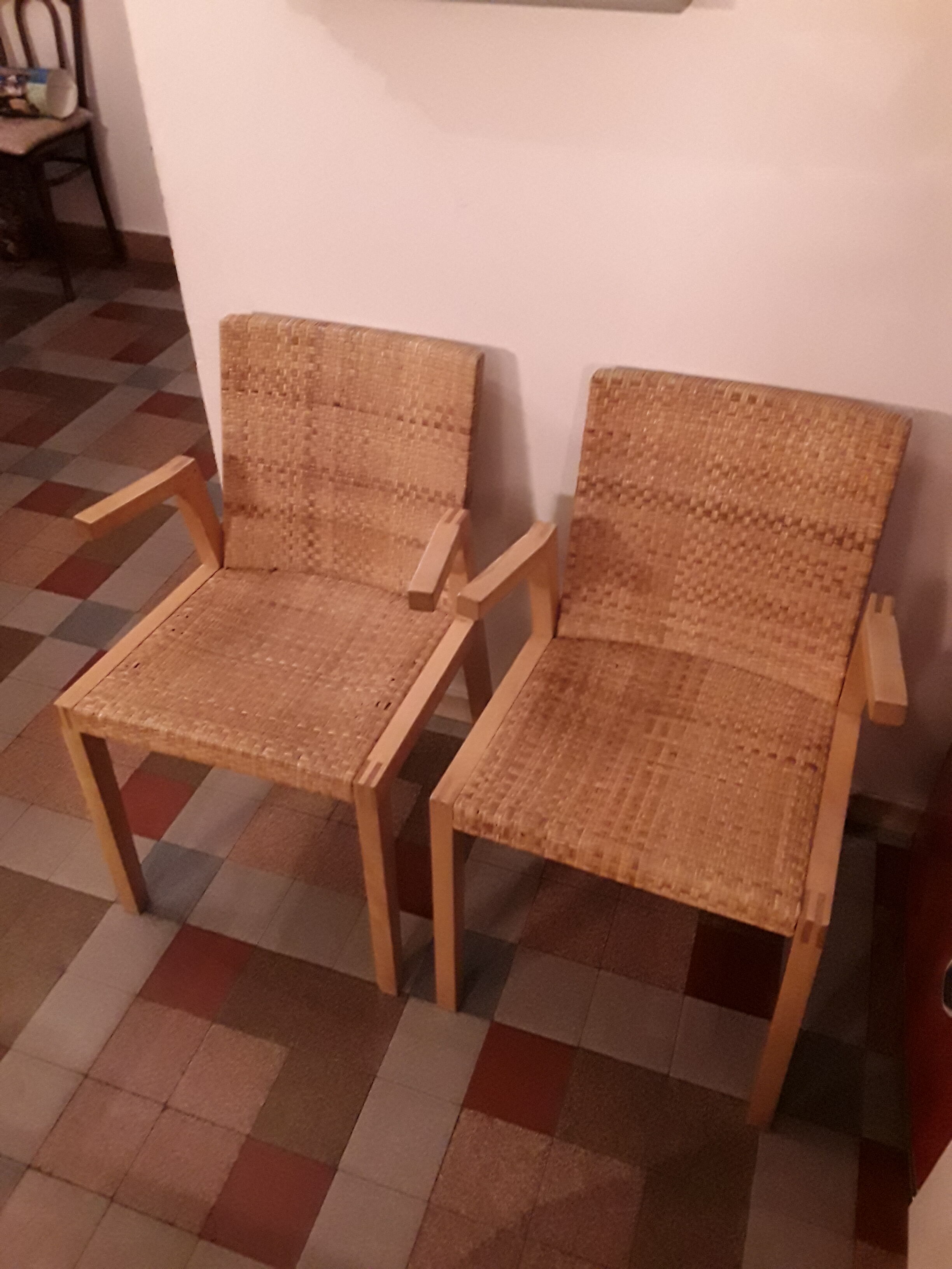 Two vintage braided straw armchairs