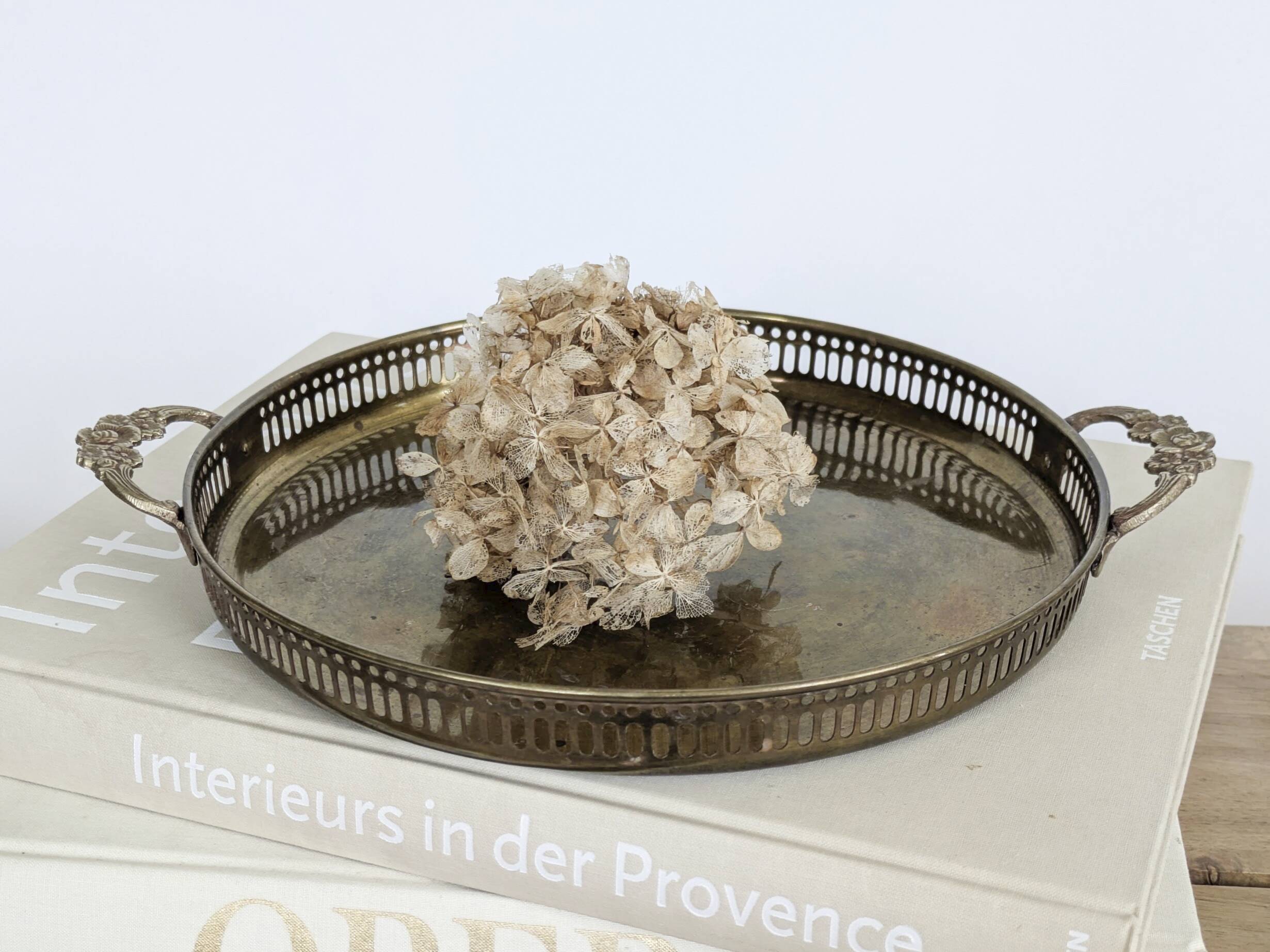 Vintage decorative brass tray, pierced edge and floral handles.