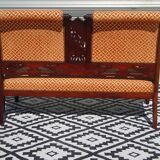 Old wooden and velvet bench