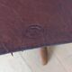 Tabouret pliant en cuir et bois