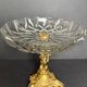 Antique crystal bowl on a bronze stand.