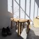 Two stools or small nesting tables in light oak.