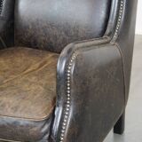 Set of 2 black cow leather armchairs finished with decorative nails, industrial style