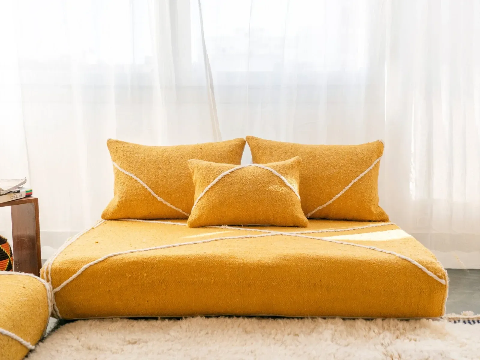 Set of yellow Moroccan floor sofa covers.