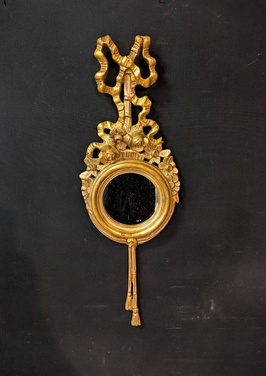 Pair of round Louis XVI style giltwood mirrors