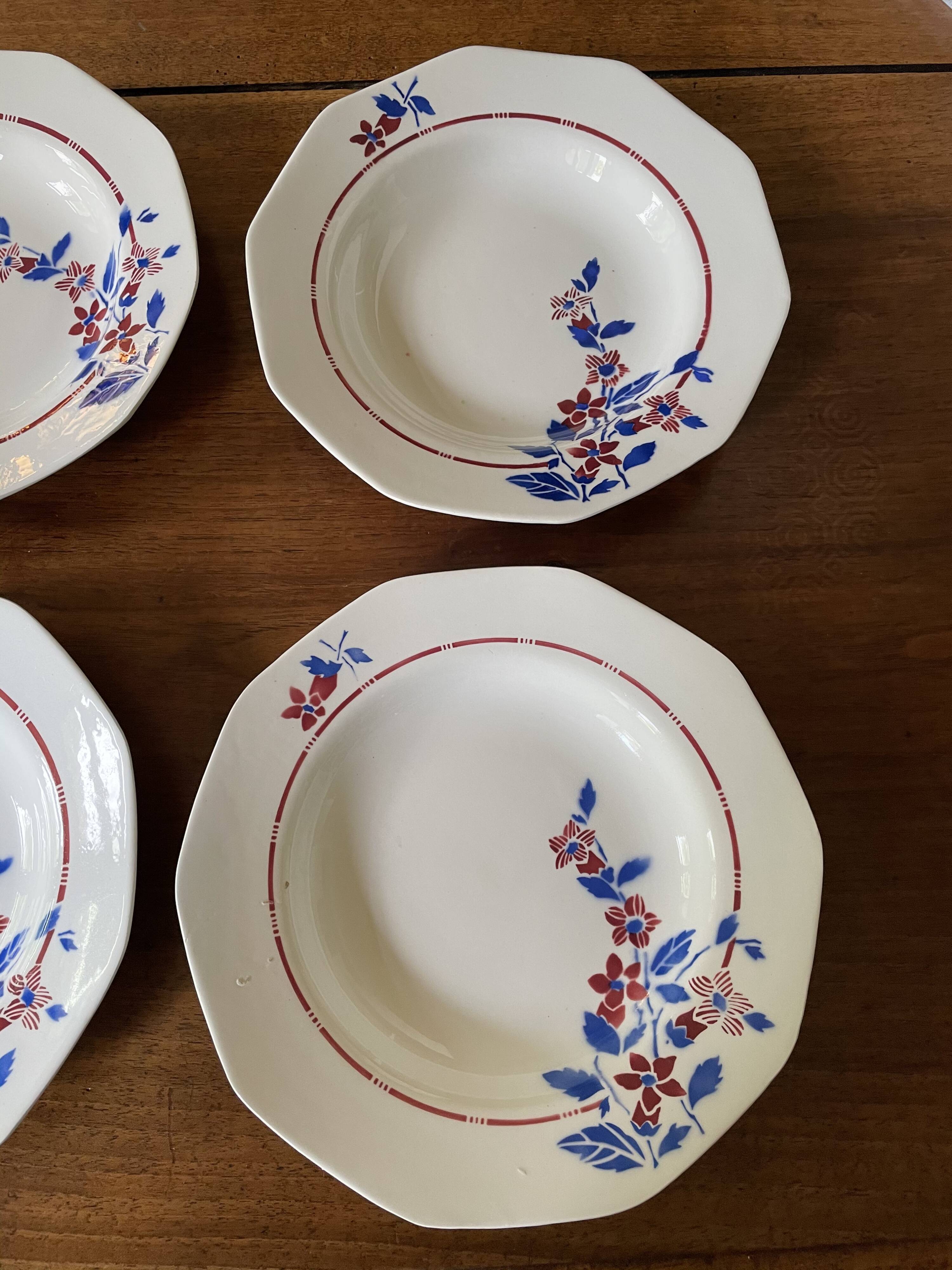 Saint Amand hollow plates decorated with red and blue flowers