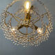 Brass chandelier with crystal pendants from the 1970s.