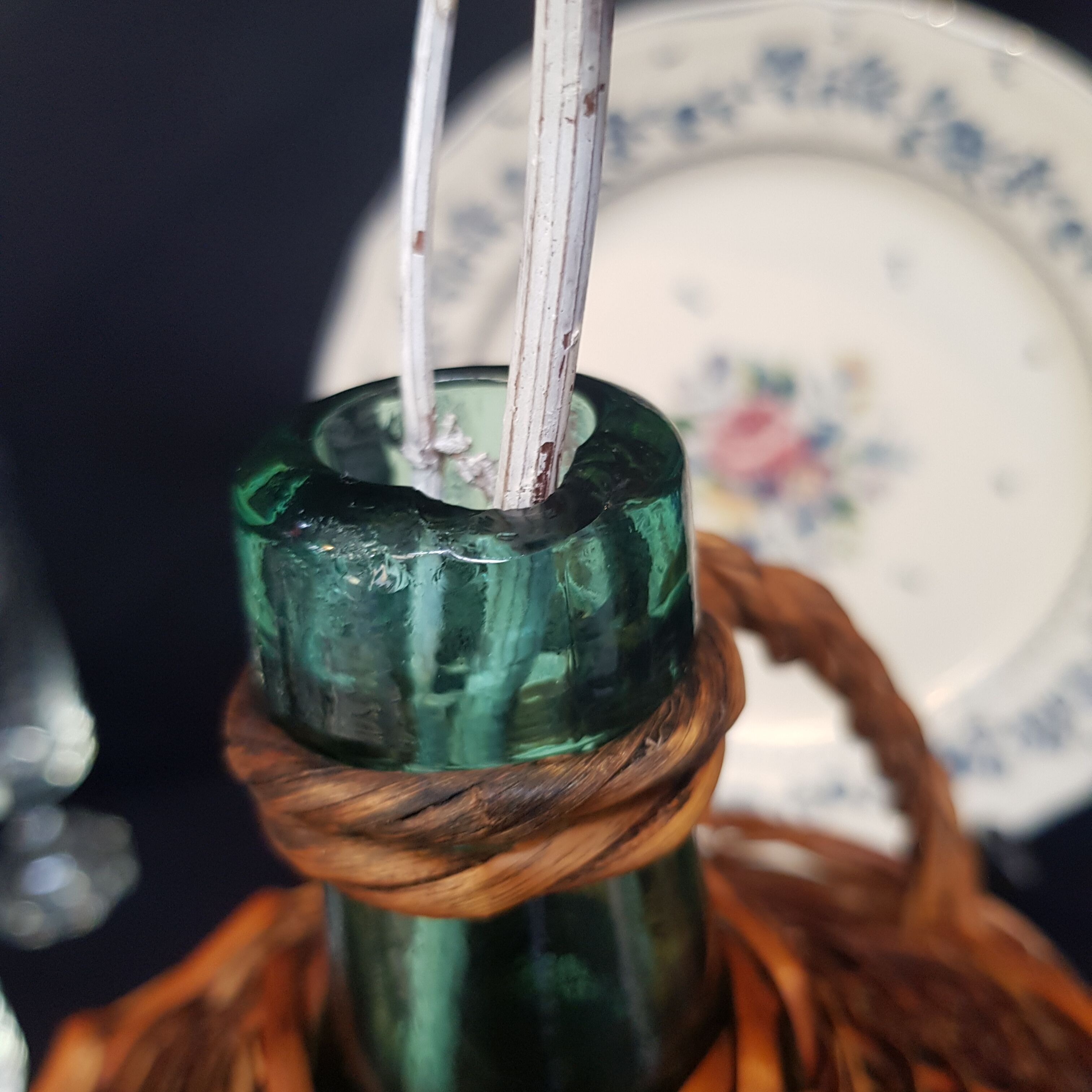 glass and rattan bottle