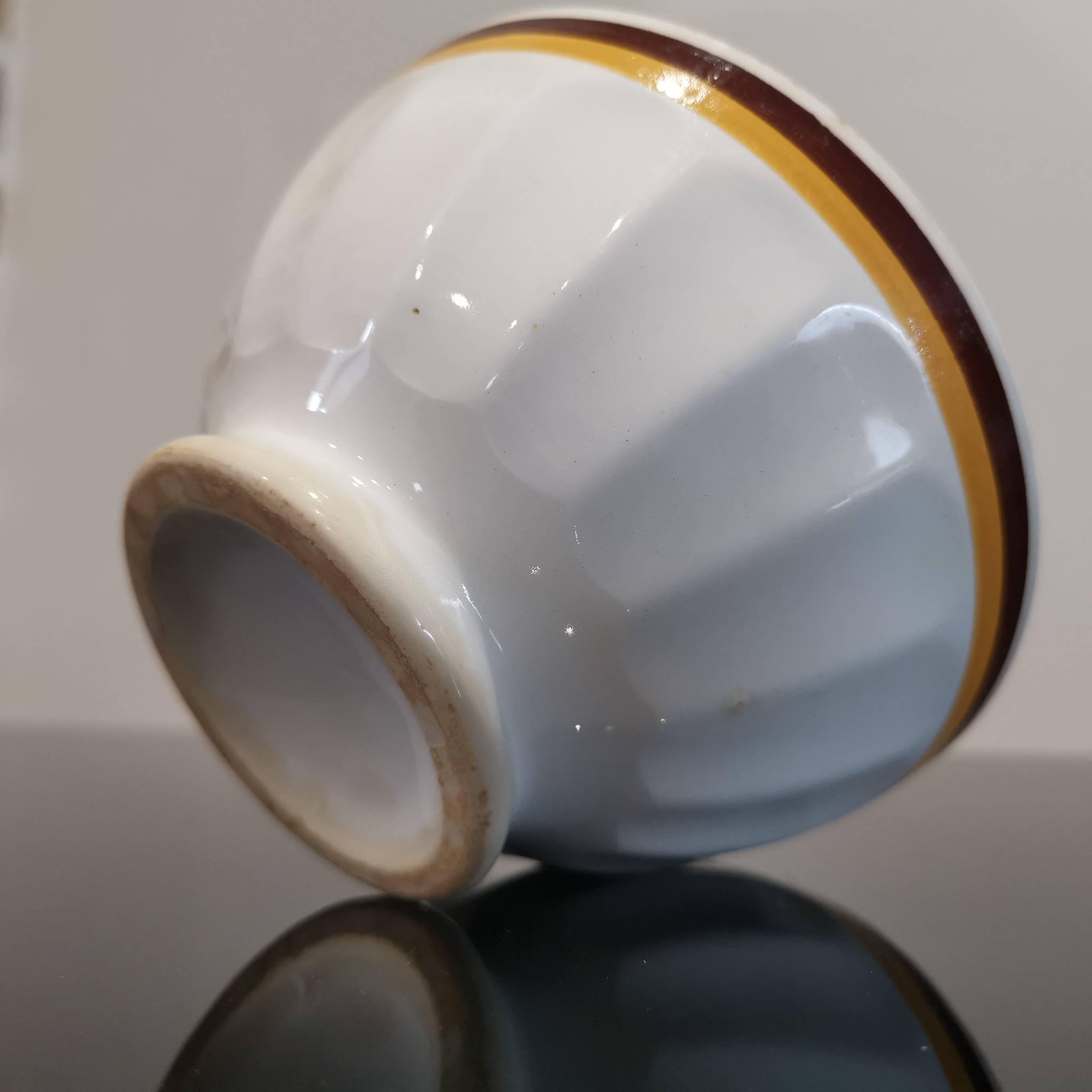 Authentic Vintage ceramic faceted bowl decorated with a double border