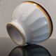 Authentic Vintage ceramic faceted bowl decorated with a double border