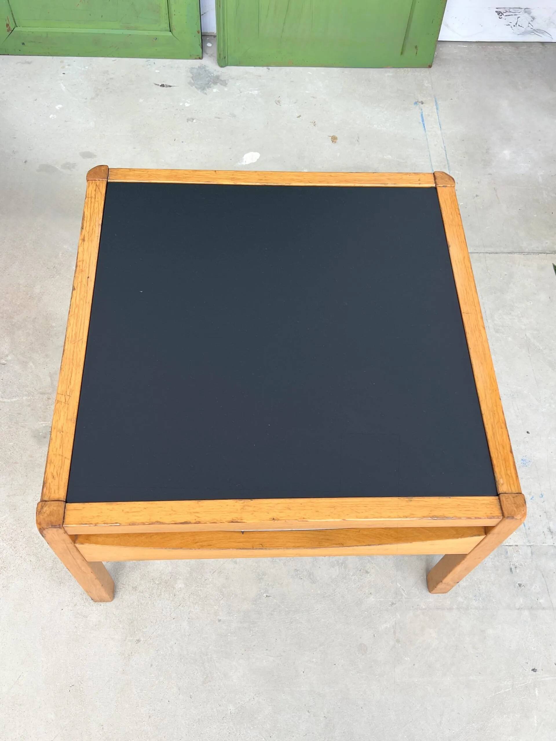 Baumann coffee table with black medium-density top