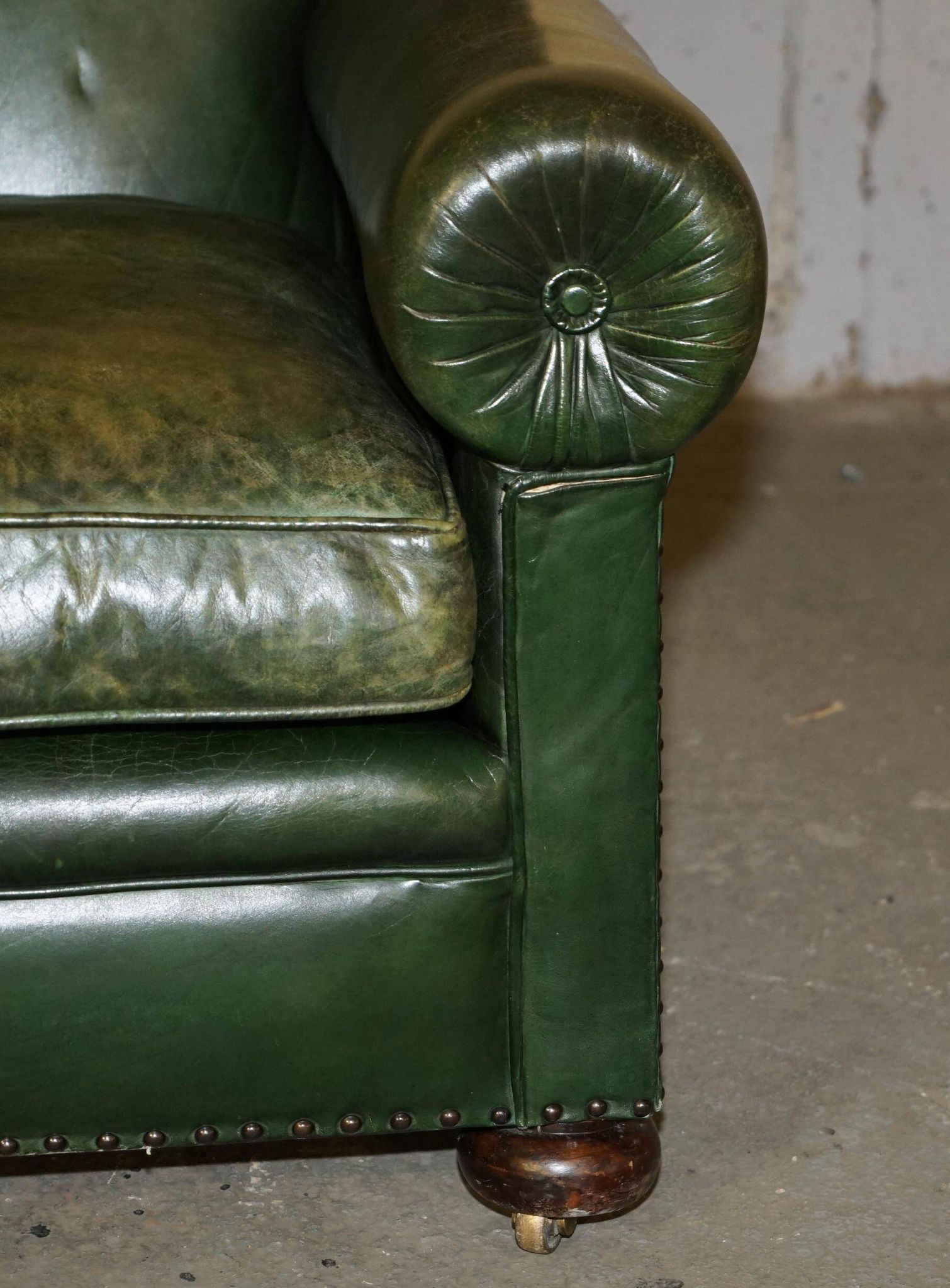 Victorian leather canapé, shield armrests, stamped Maple & Co.