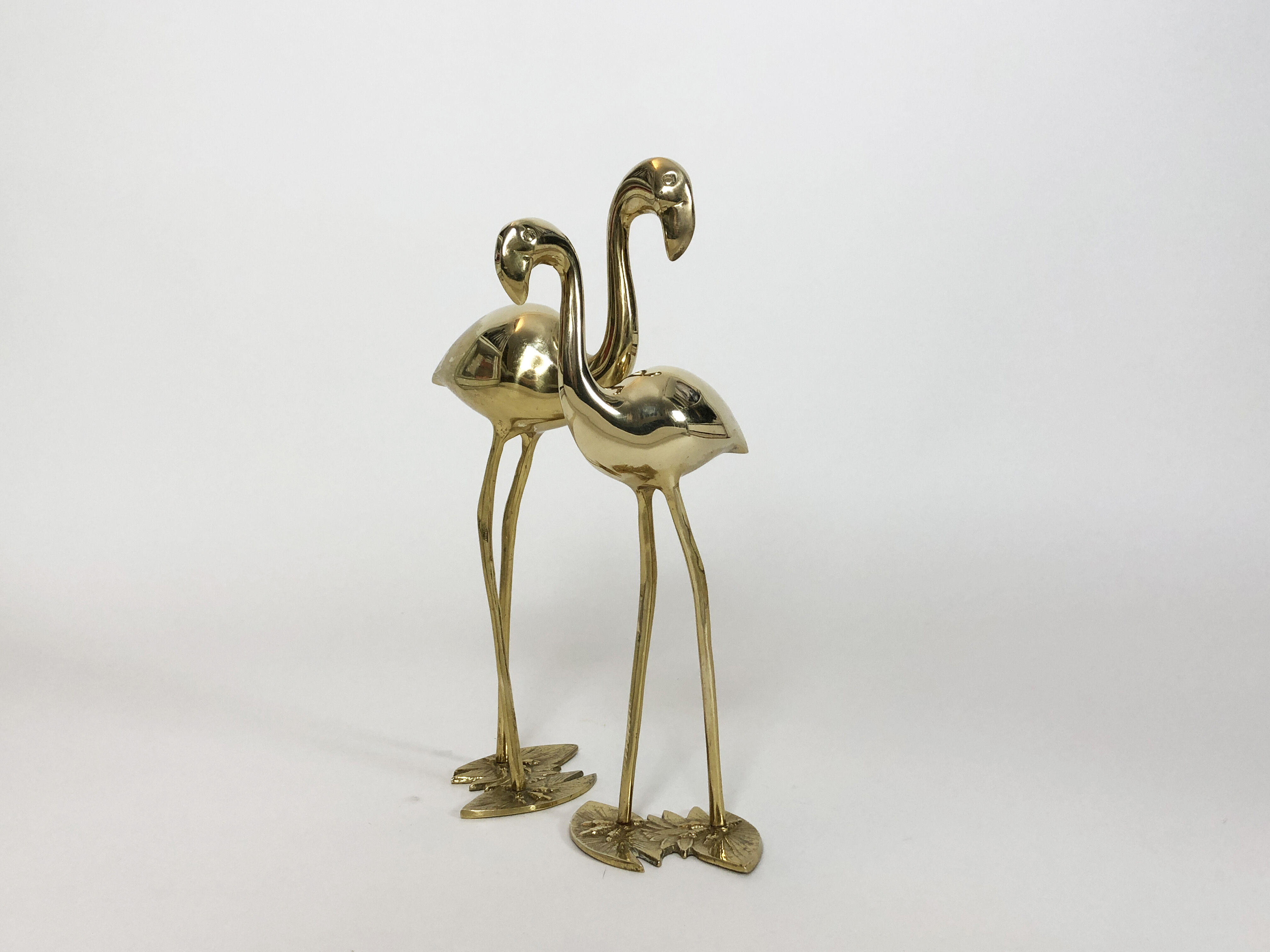 Pair of cranes or Hollywood regency herons in golden brass from the 70