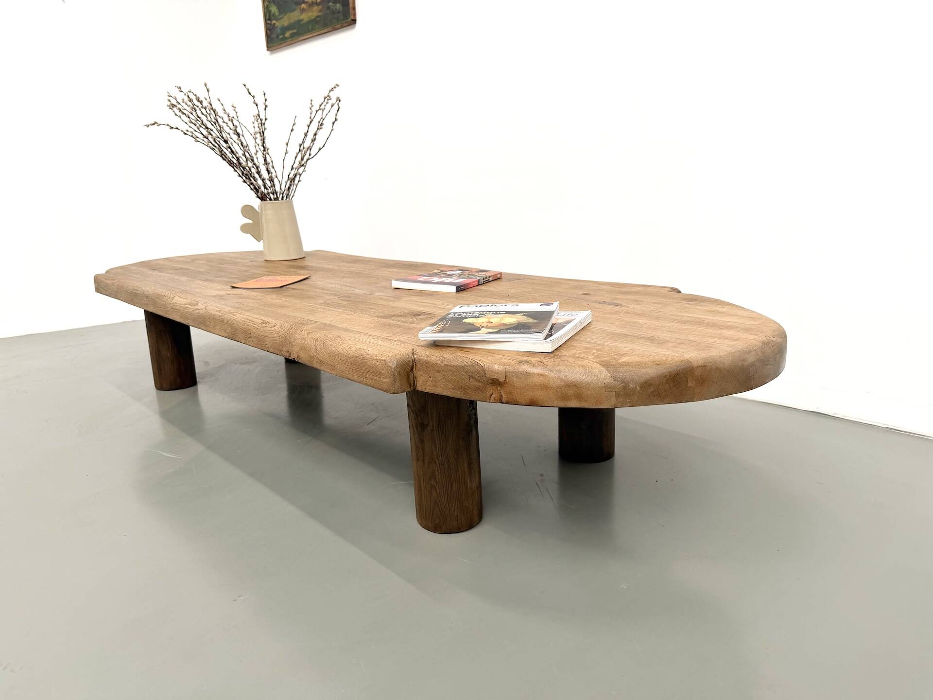 XXL oval coffee table in solid oak, cylindrical base, 1950s.
