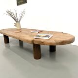 XXL oval coffee table in solid oak, cylindrical base, 1950s.