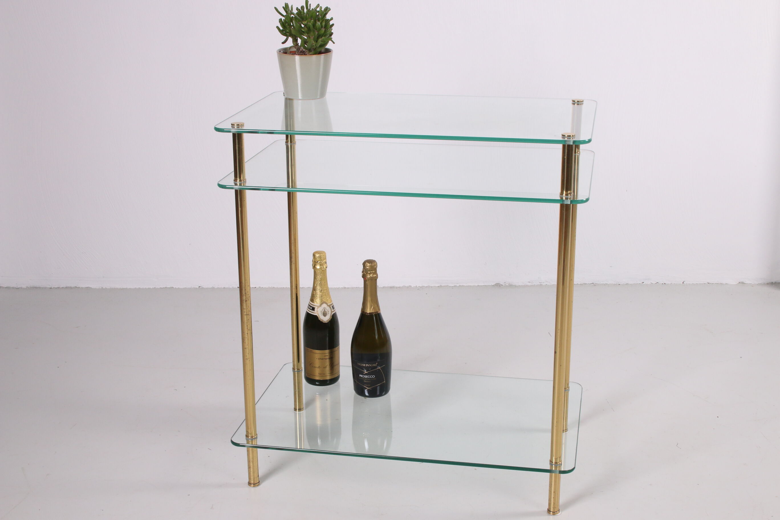 Hollywood Regency side table with gold-colored legs