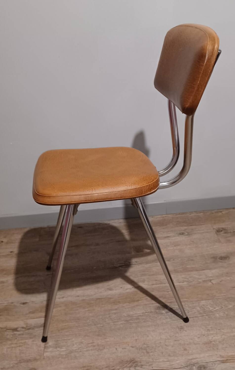 Pair of vintage faux leather and chrome chairs