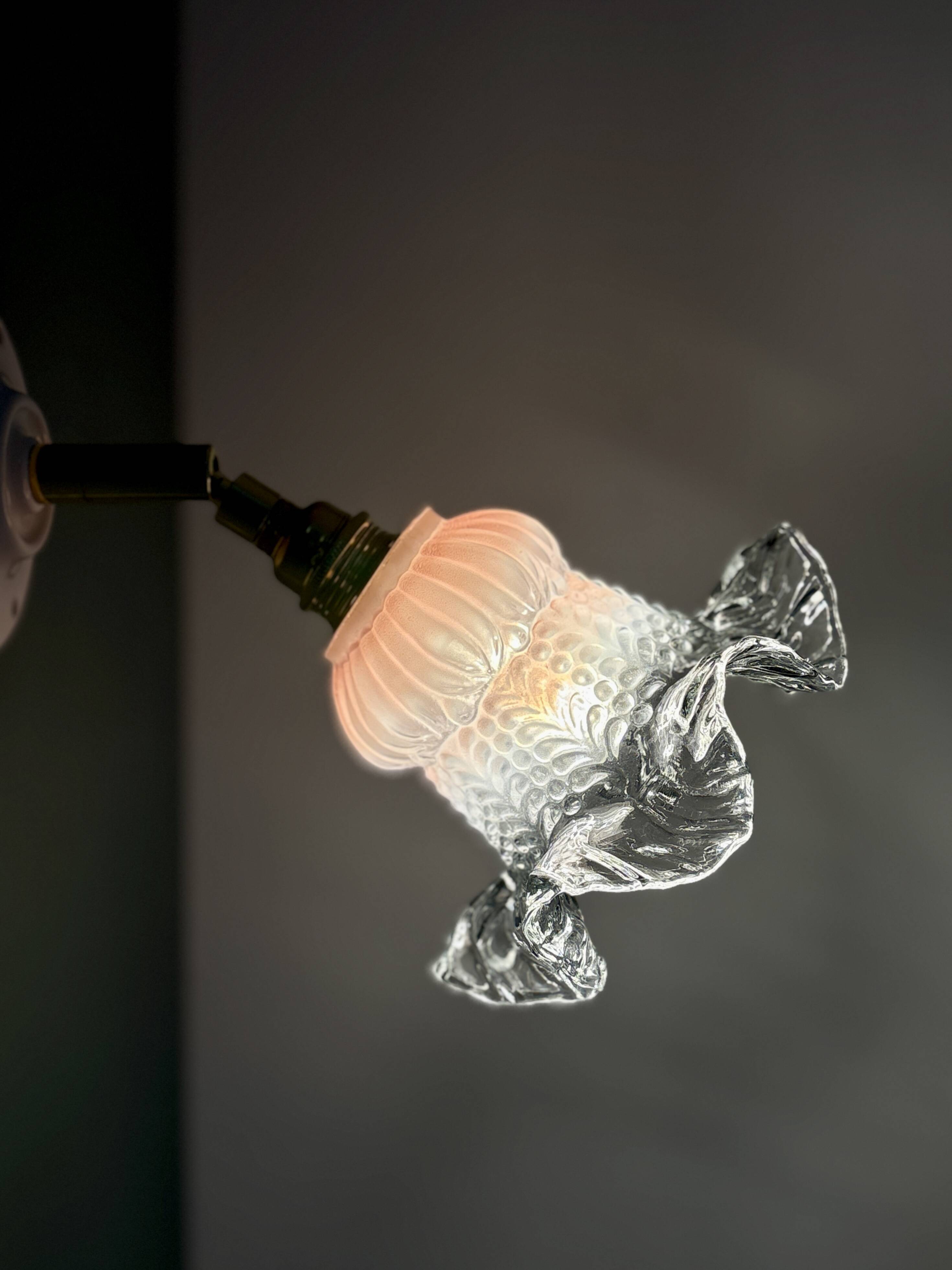 Vintage pink and clear glass tulip wall light.