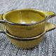 Set of 2 glazed khaki clay bowls.