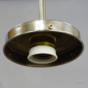 Functional Bauhaus-style pendant light with opaline glass shade.
