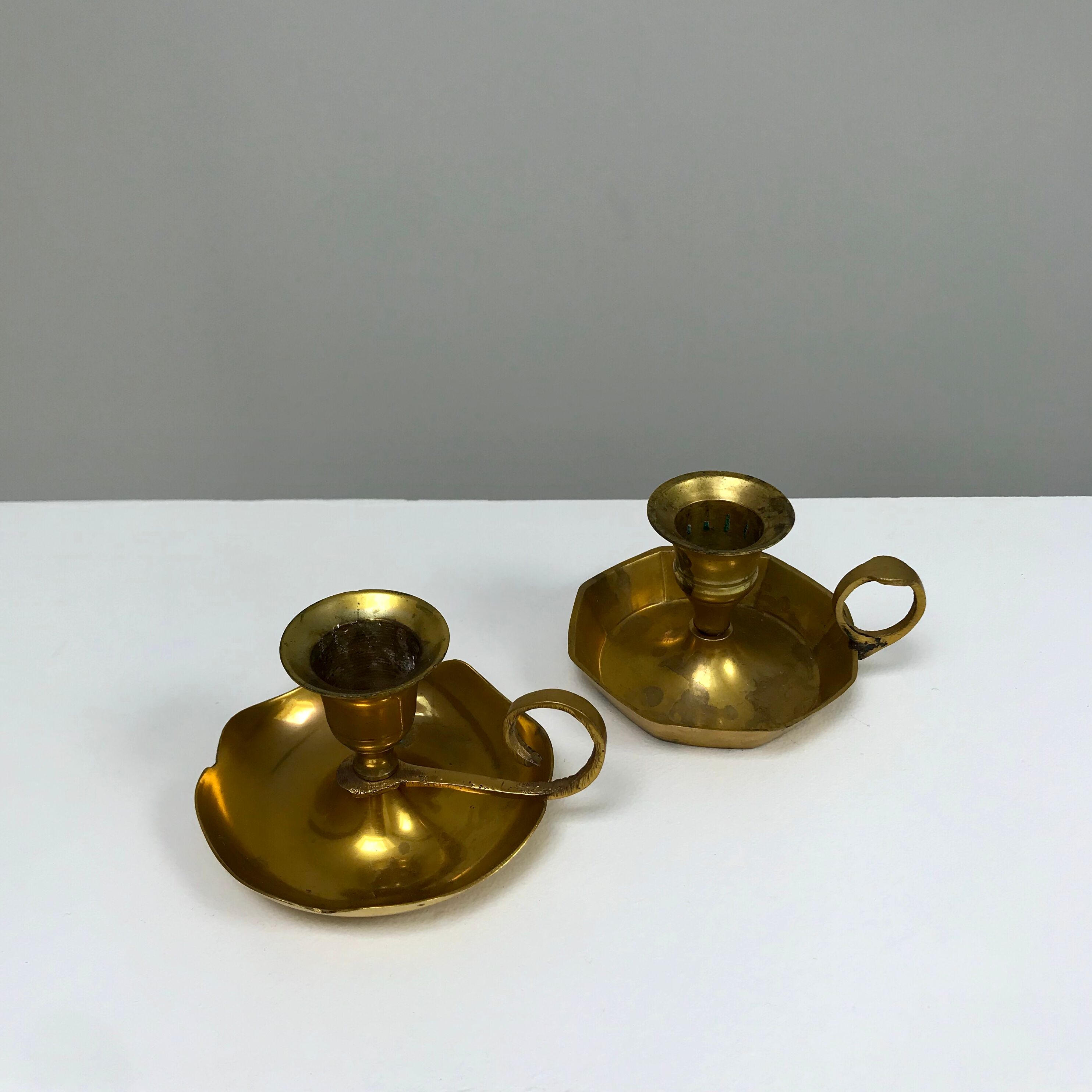 Duo of brass candlesticks