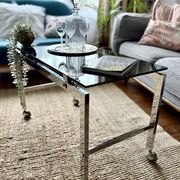 Chrome and smoked glass coffee table on wheels 1970