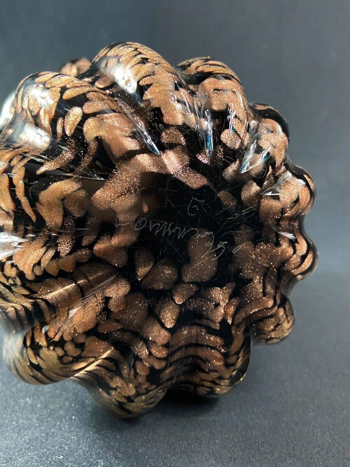 Vase signed in Murano Venice crystal with gold inclusion on a black background