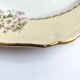 Round vintage plate L'Amandinoise model Paola cream and white flowers