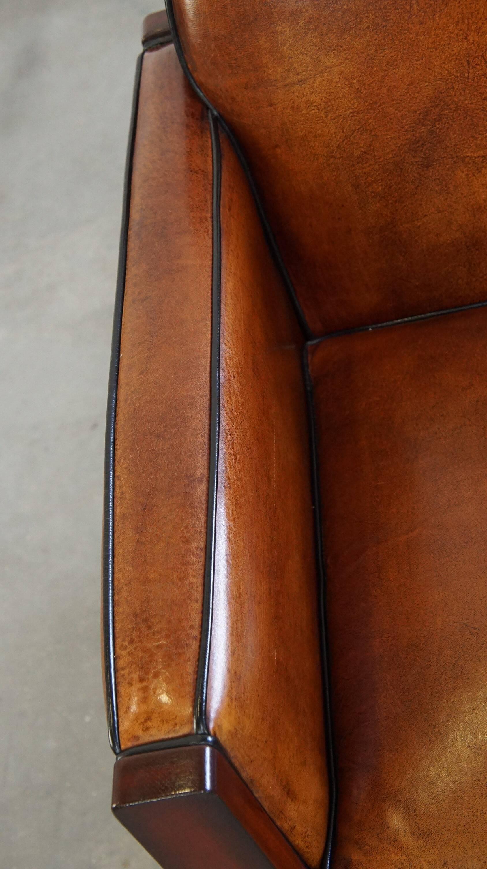 Cognac-colored sheepskin Art Deco design armchair in good condition