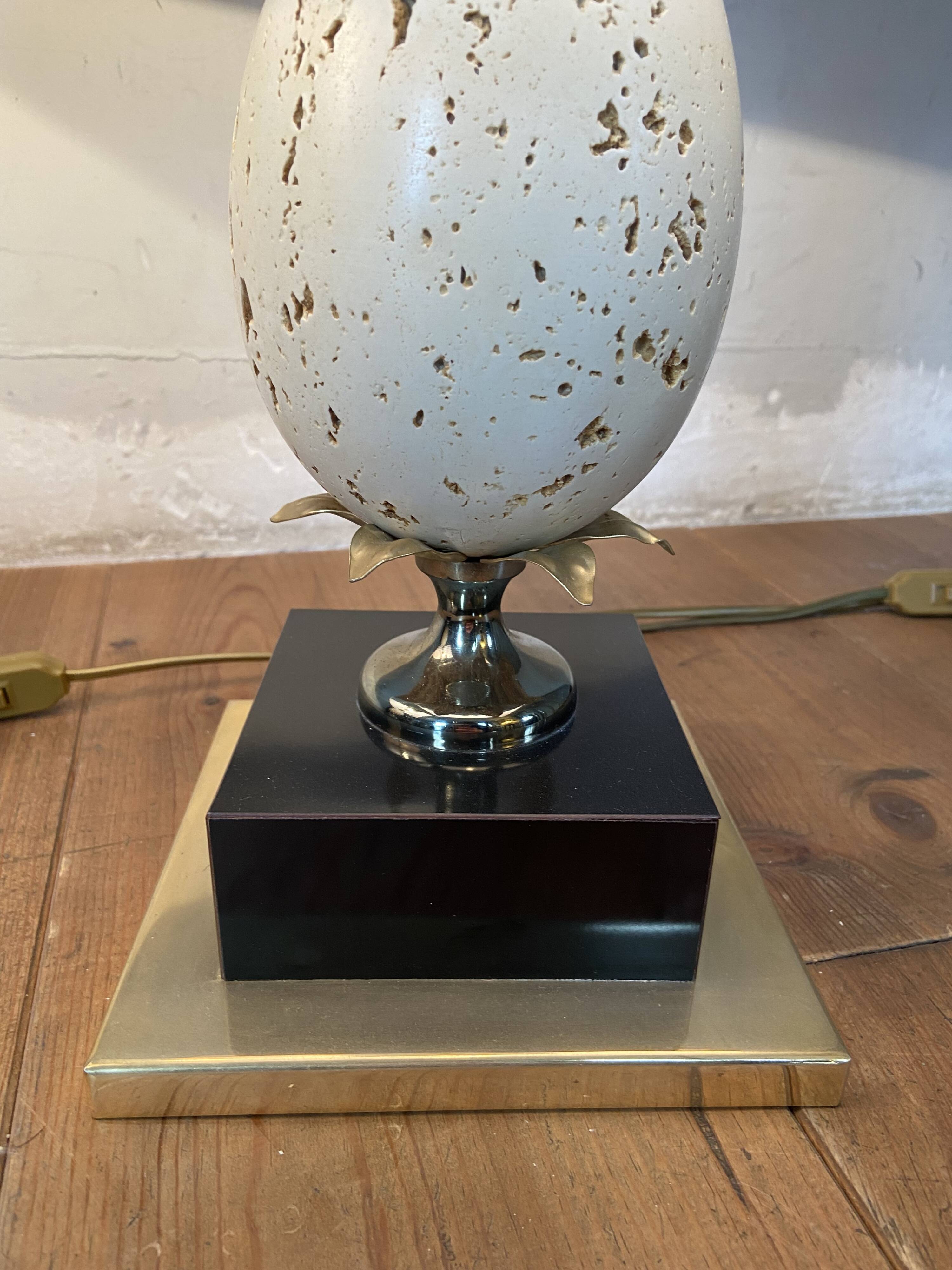 Pair of designer ostrich egg lamps in travertine from maison barbier