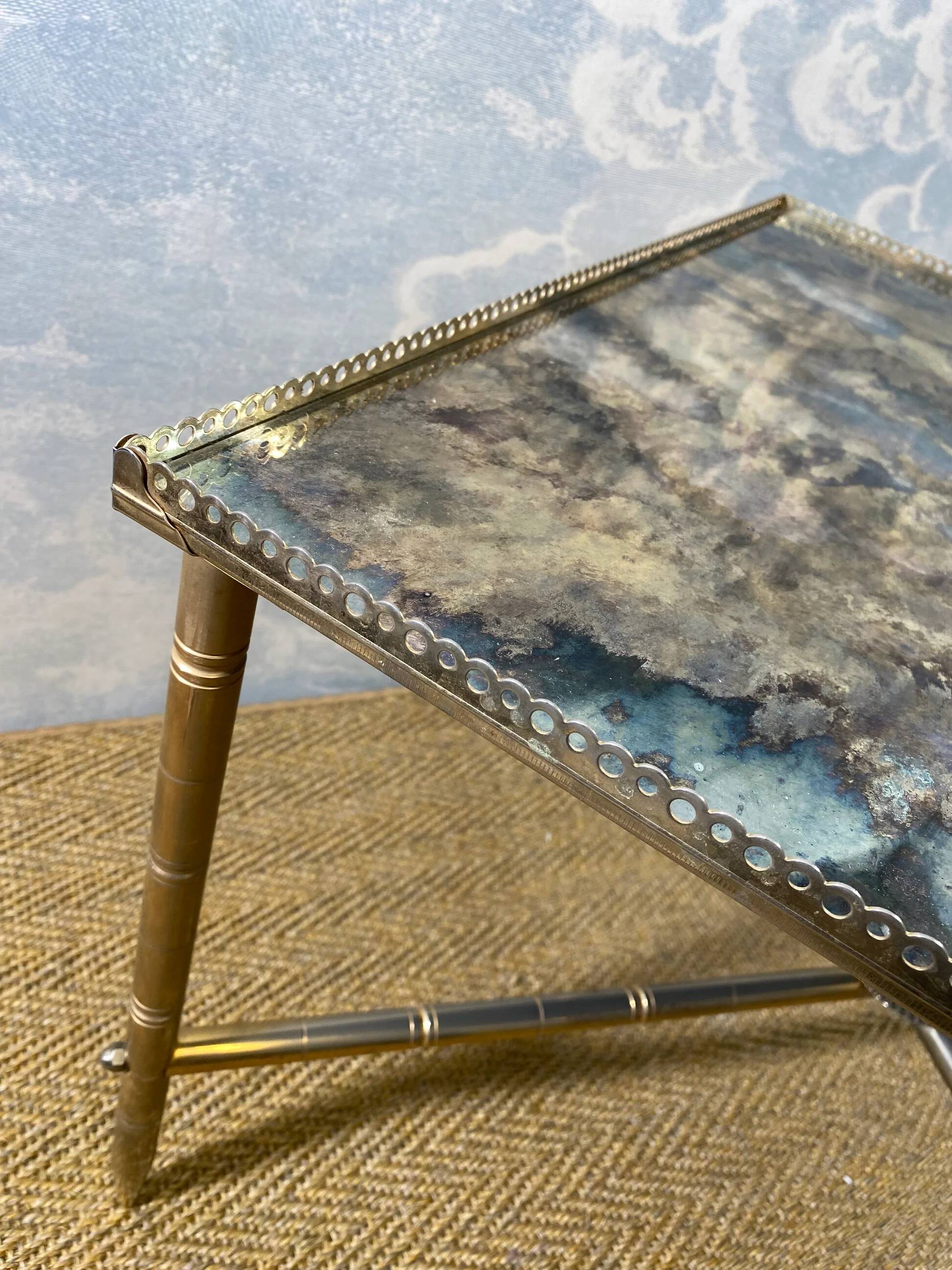 Side table with oxidised metal mirror top on a brass frame, France, 1960s.