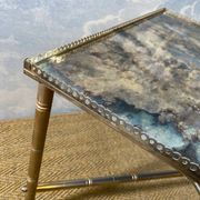 Side table with oxidised metal mirror top on a brass frame, France, 1960s.