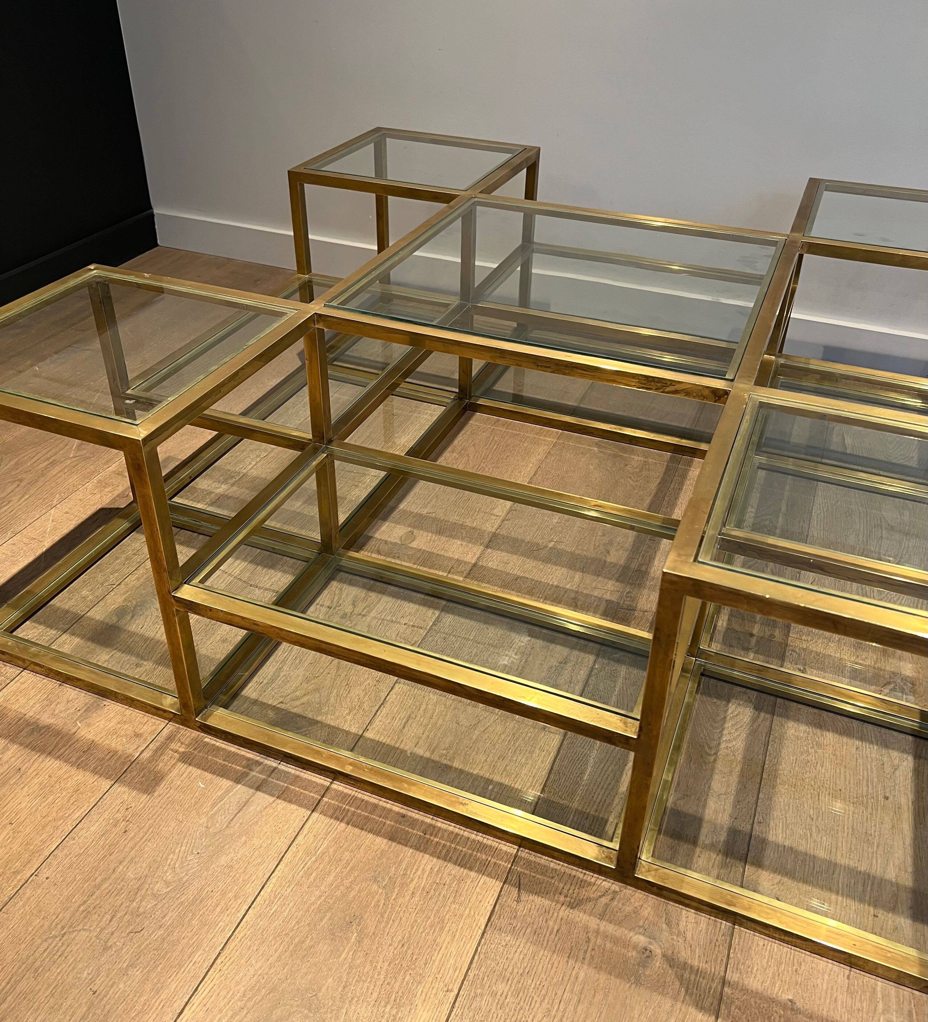 Important brass coffee table with multiple levels.