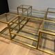 Important brass coffee table with multiple levels.