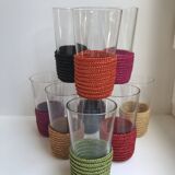 set of 9 small glasses with colored rattan support from the 70s