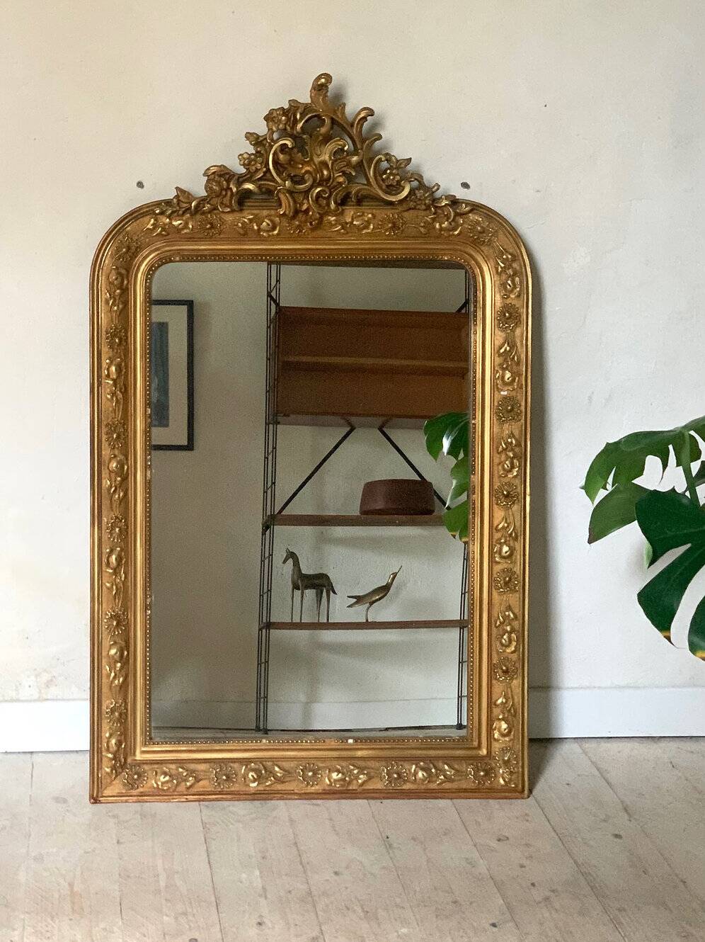 Gilded fireplace mirror with pediment