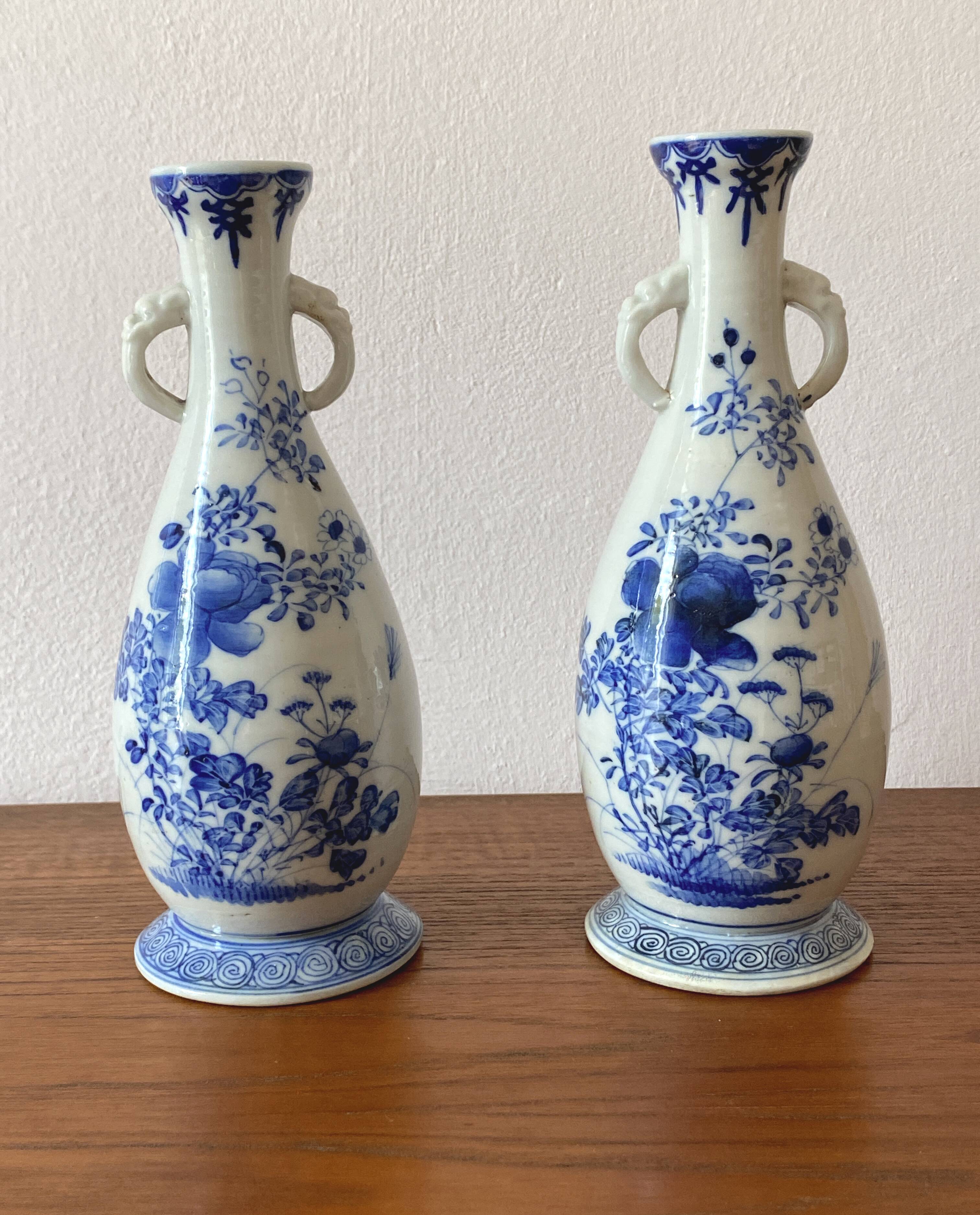 Old pair of blue and white porcelain vases from Japan - in good condition.