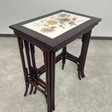 Nested tables in curved wood with ceramic top by Thonet.