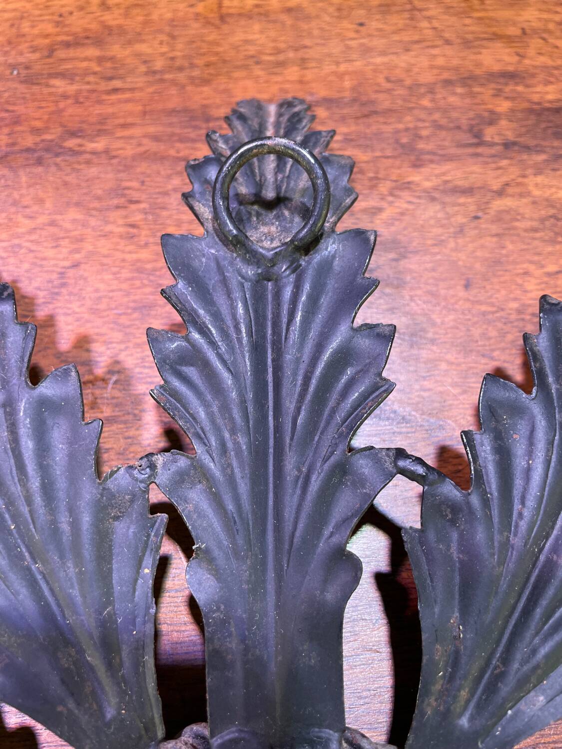 Metal mirror with foliage decoration