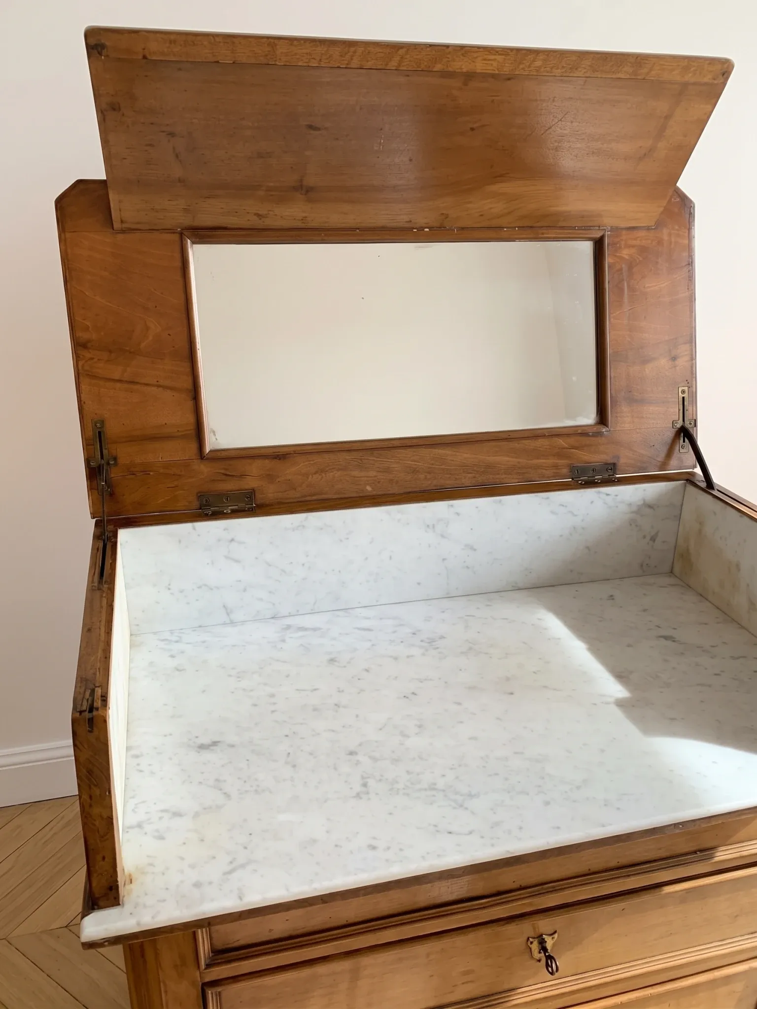 Antique wooden and marble dressing table with mirror.
