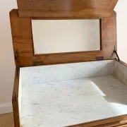 Antique wooden and marble dressing table with mirror.