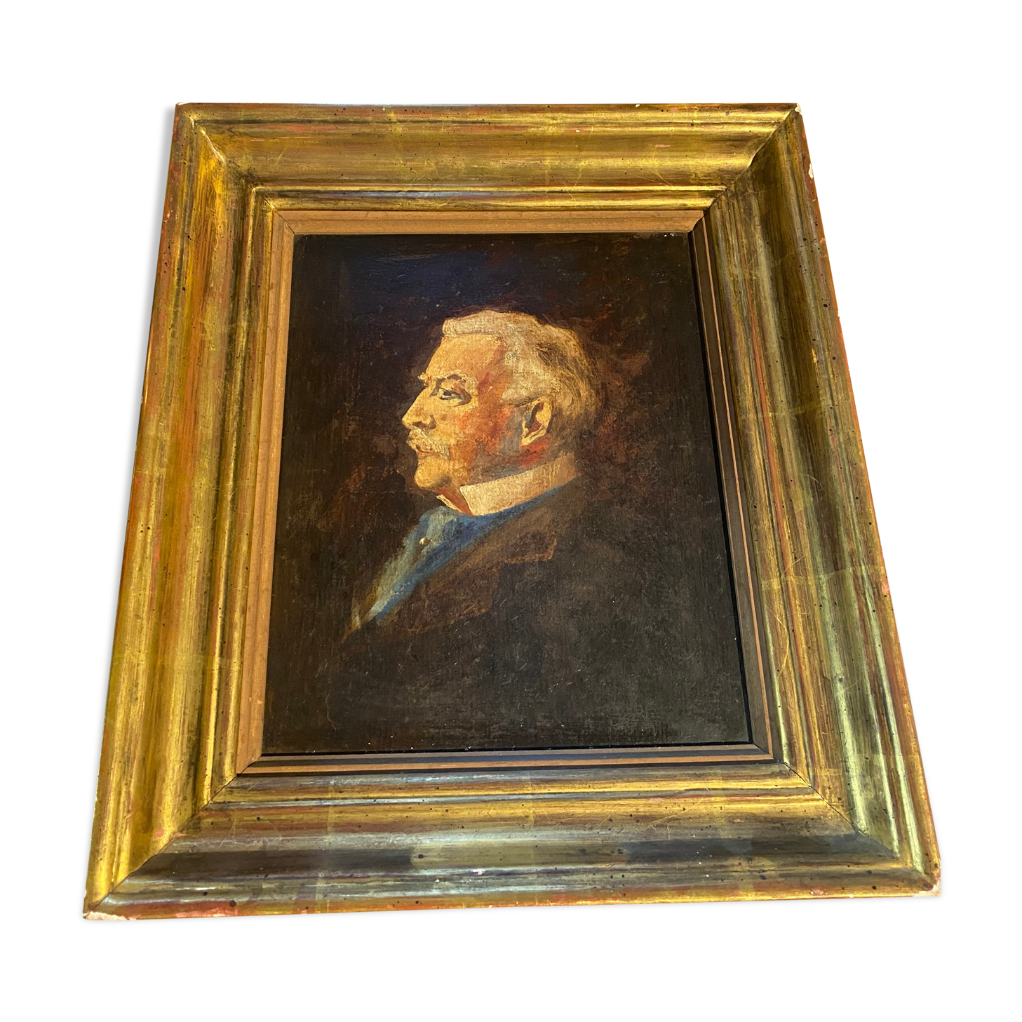 Old portrait in gilded wood