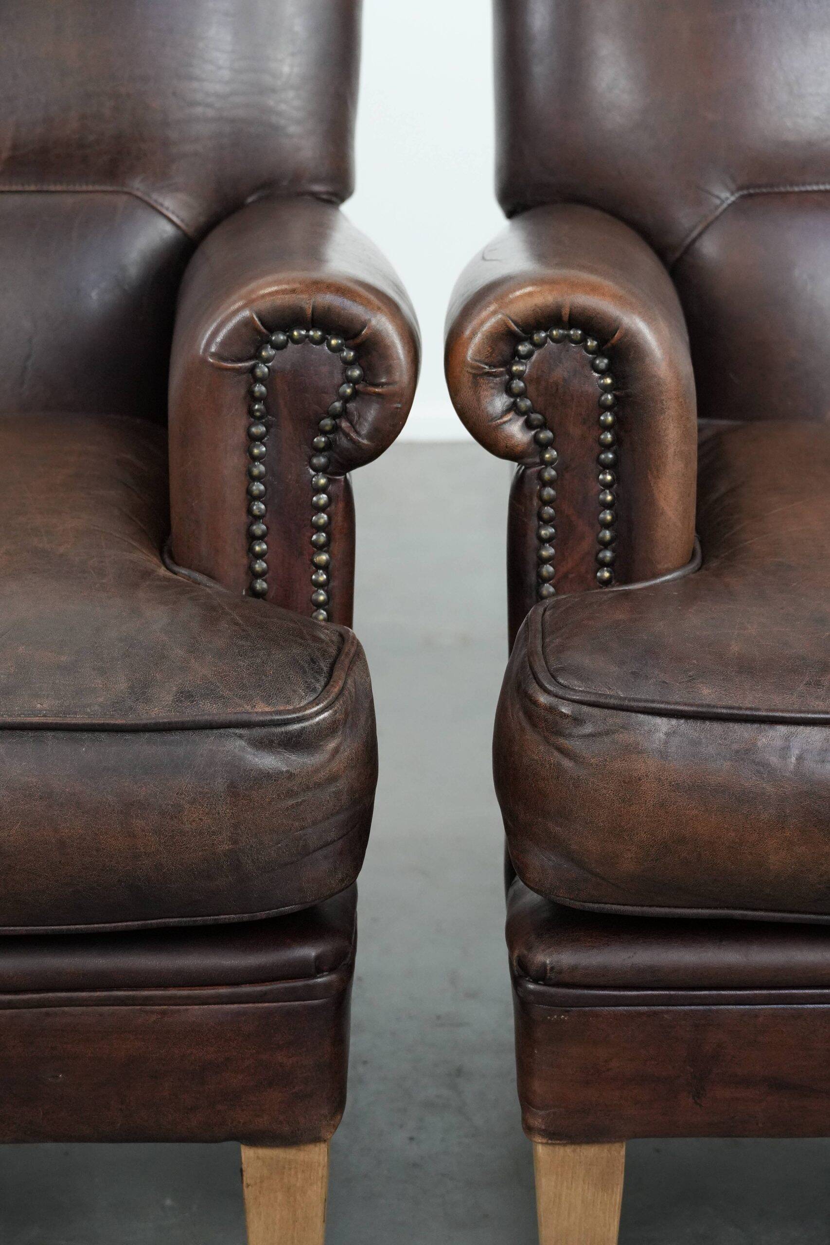 Set of two characterful sheepskin armchairs with a beautiful deep colour