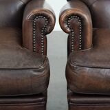 Set of two characterful sheepskin armchairs with a beautiful deep colour